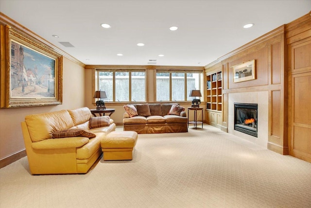 living room with crown molding, a fireplace, and carpet