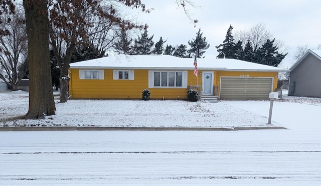 ranch-style house featuring a garage