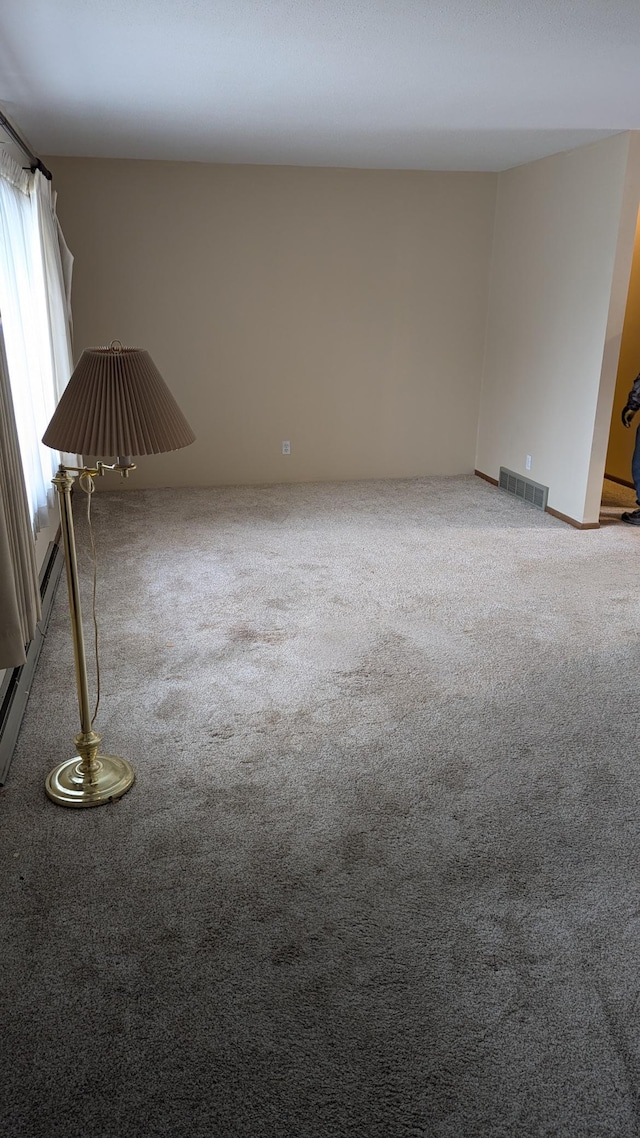 unfurnished room with carpet