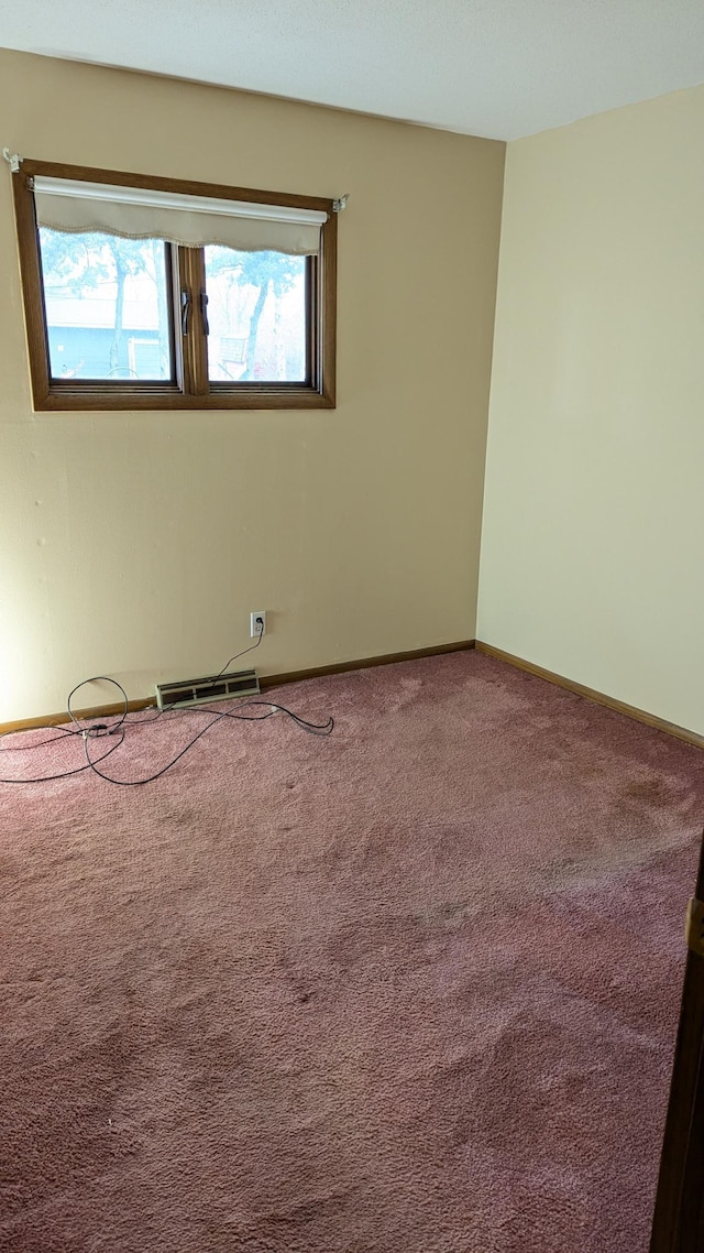 carpeted spare room with a healthy amount of sunlight