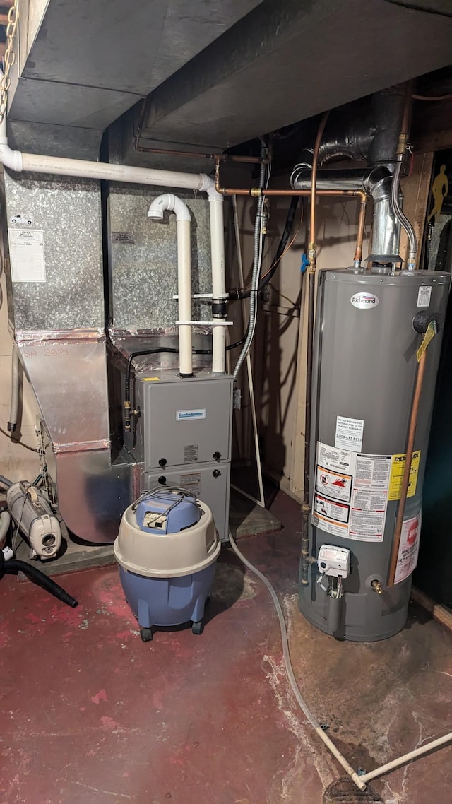 utility room featuring gas water heater