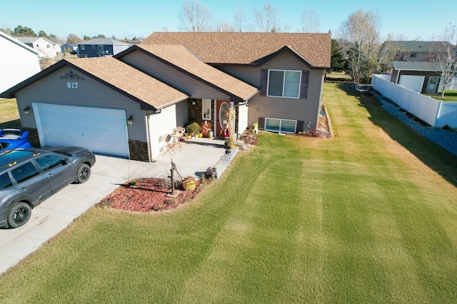 view of front of house featuring a garage and a front yard