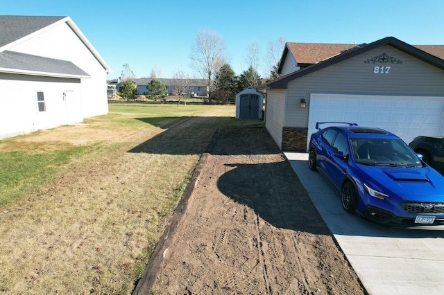 view of home's exterior featuring a shed, a garage, and a lawn