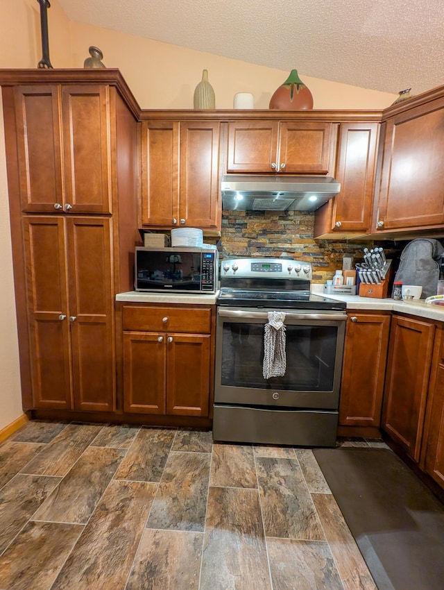 kitchen with stainless steel electric range, lofted ceiling, a textured ceiling, and tasteful backsplash