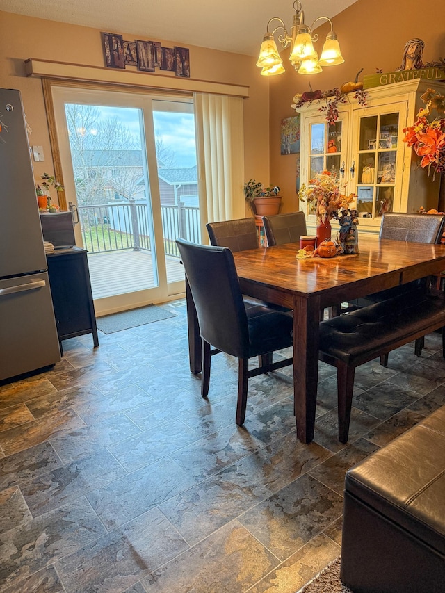 dining area featuring a chandelier