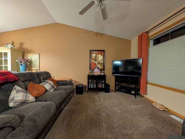 carpeted living room featuring a textured ceiling, vaulted ceiling, and ceiling fan