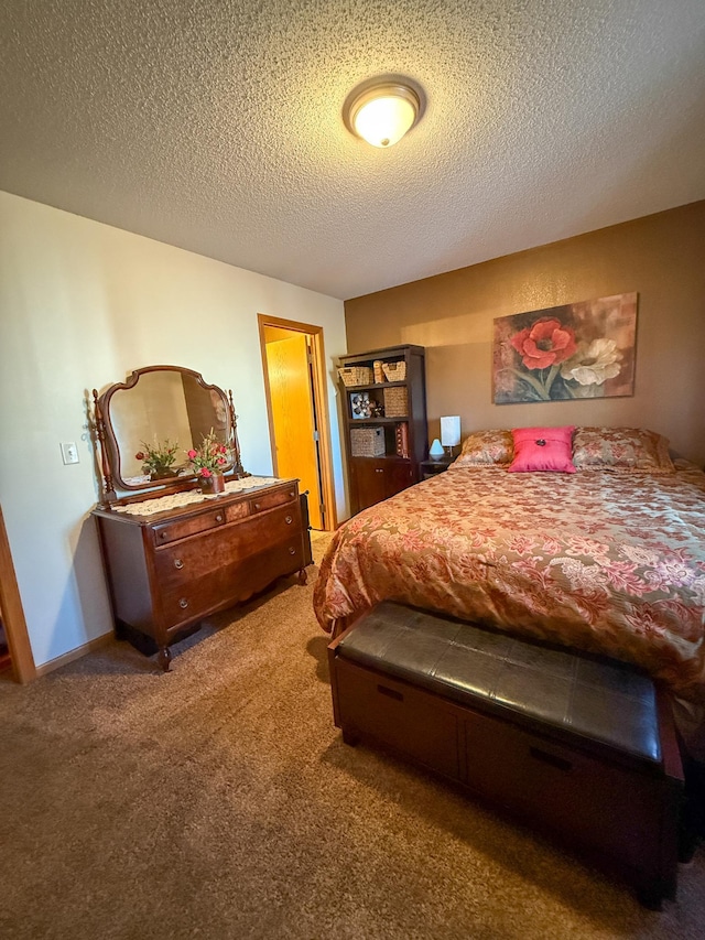 carpeted bedroom with a textured ceiling