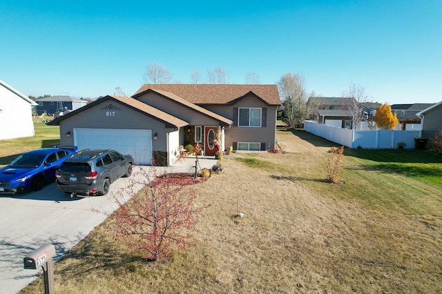 view of front of home featuring a garage and a front yard