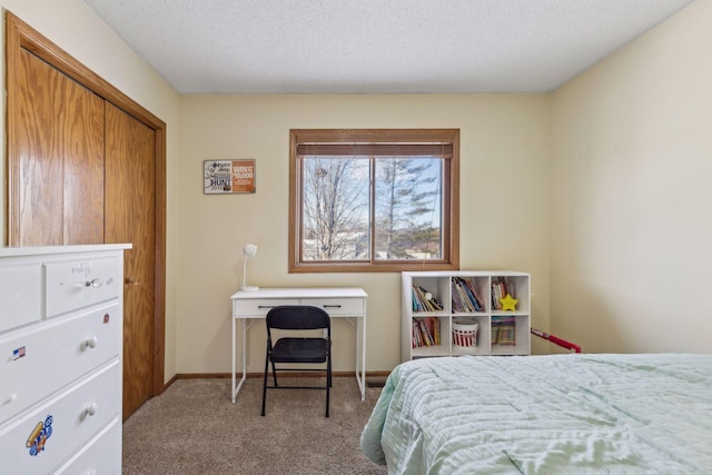 carpeted bedroom featuring a textured ceiling