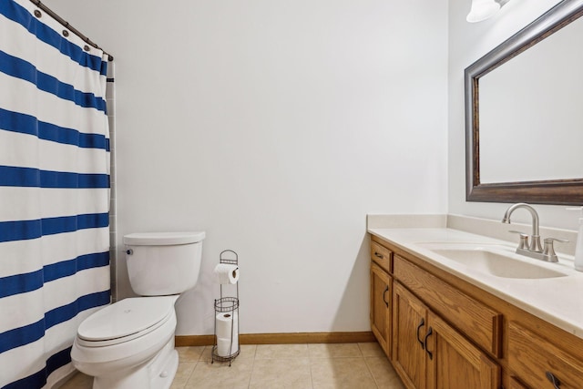 bathroom with curtained shower, tile patterned flooring, vanity, and toilet