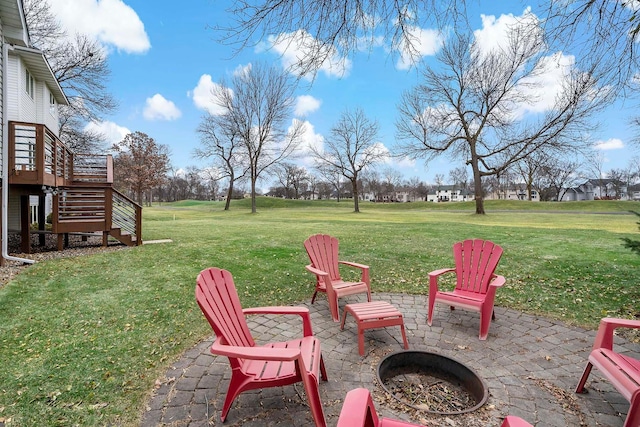 view of yard with a fire pit and a patio area