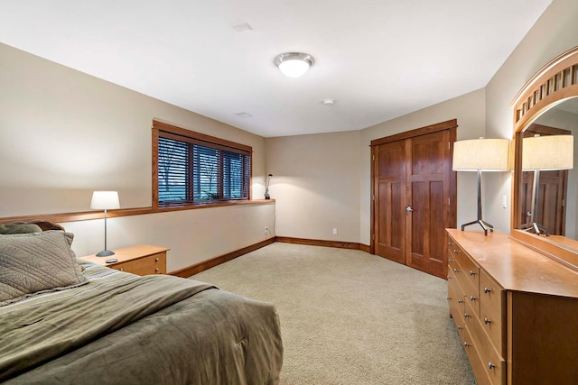 carpeted bedroom featuring a closet