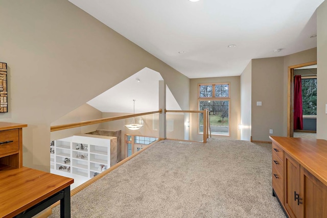 hallway featuring light carpet