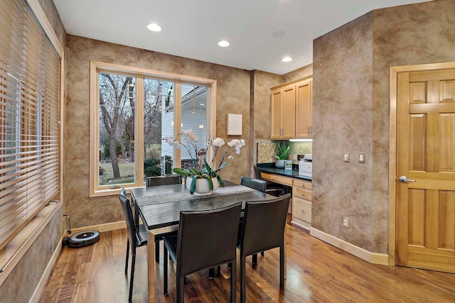 dining area featuring hardwood / wood-style flooring