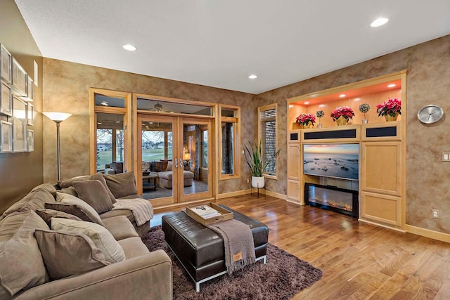 living room featuring hardwood / wood-style floors and french doors