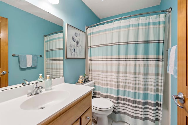 bathroom with vanity, toilet, and curtained shower