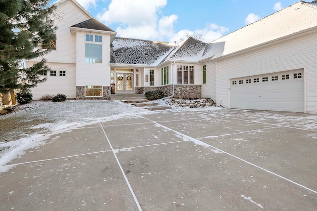 view of front of house with french doors and a garage