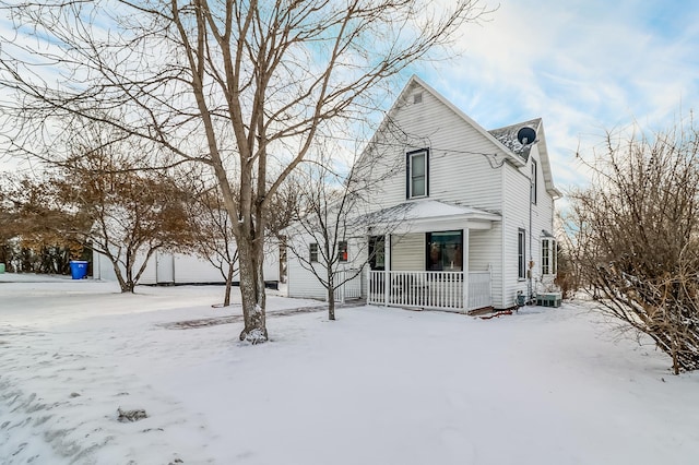 view of front property featuring central AC unit and covered porch