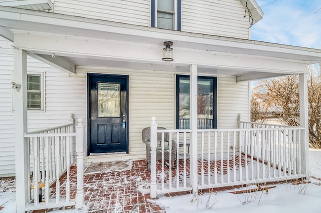 view of snow covered property entrance