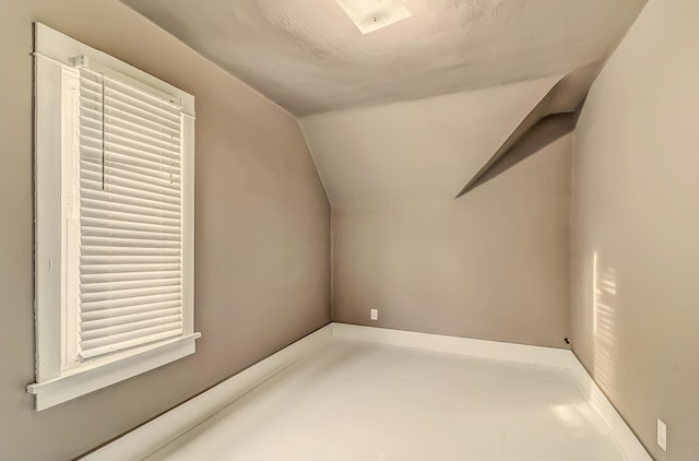 bonus room with vaulted ceiling