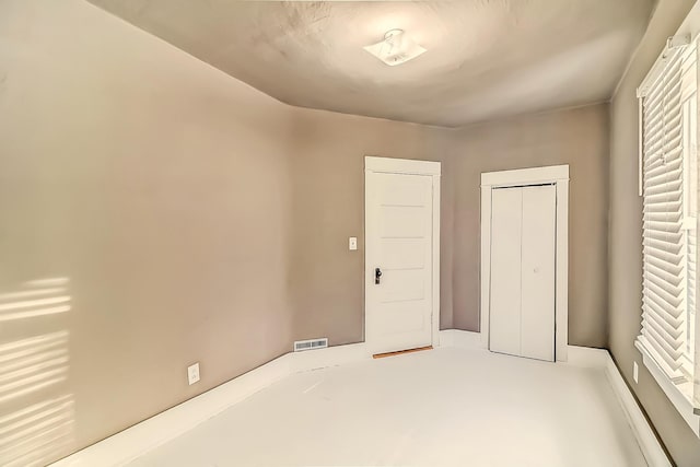 unfurnished bedroom with a closet