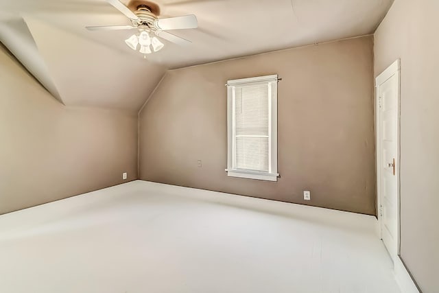 additional living space featuring vaulted ceiling and ceiling fan