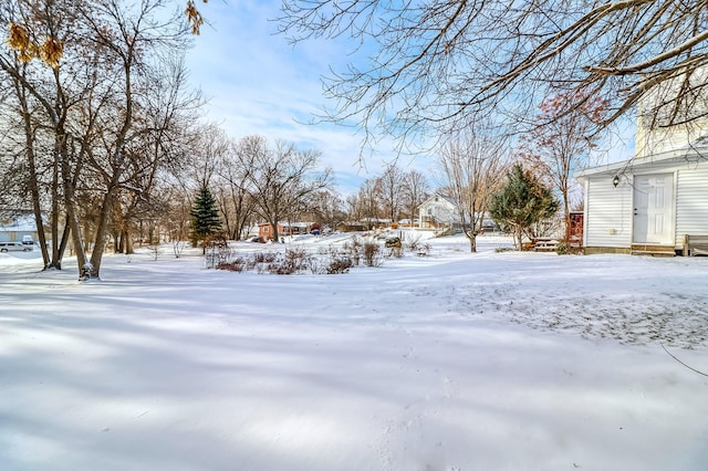 view of yard layered in snow