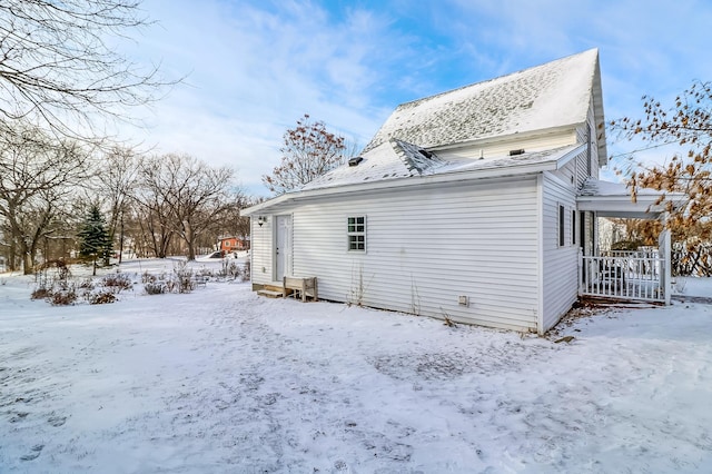 view of snow covered house