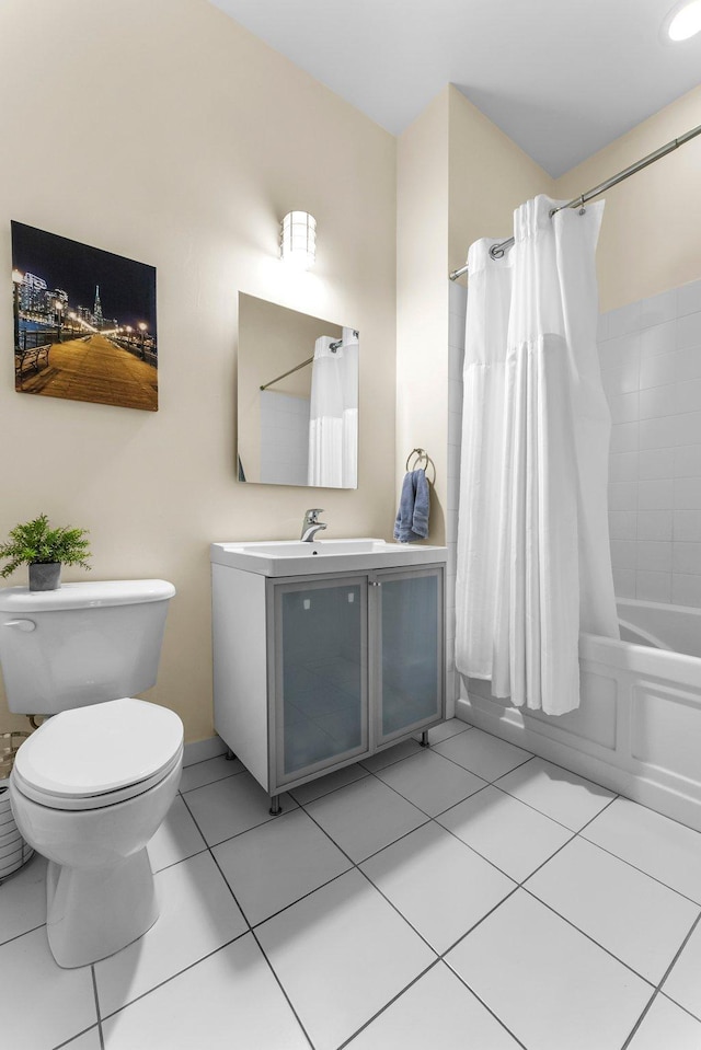 full bathroom featuring tile patterned flooring, vanity, toilet, and shower / tub combo