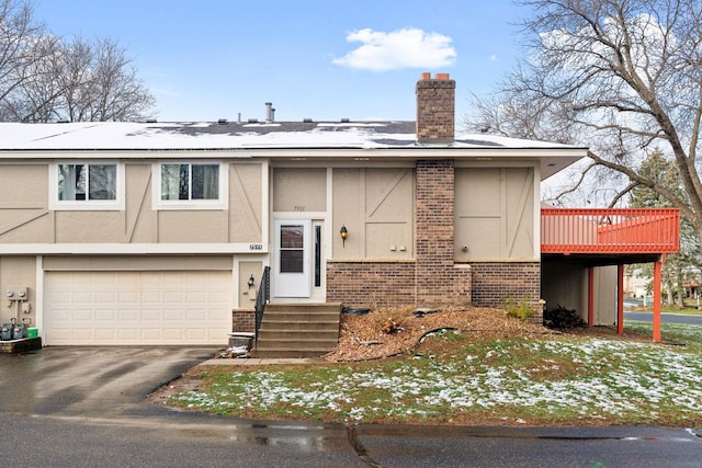 view of front of property with a garage and a wooden deck