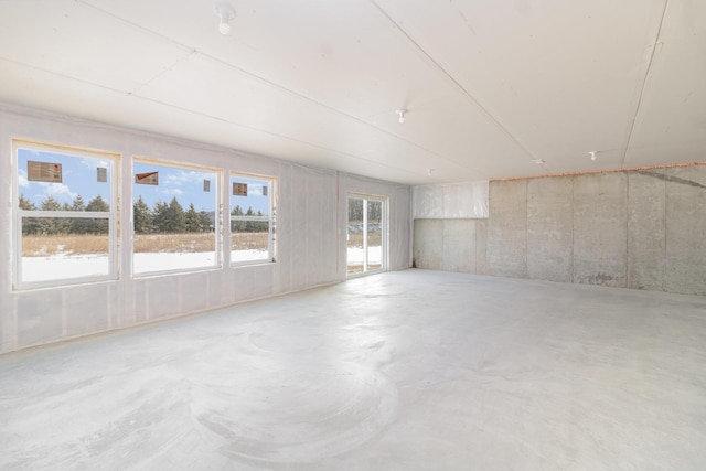 empty room with concrete flooring