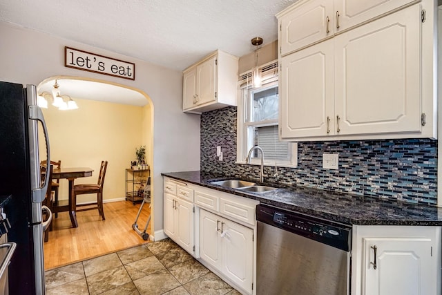 kitchen with white cabinets, sink, and appliances with stainless steel finishes