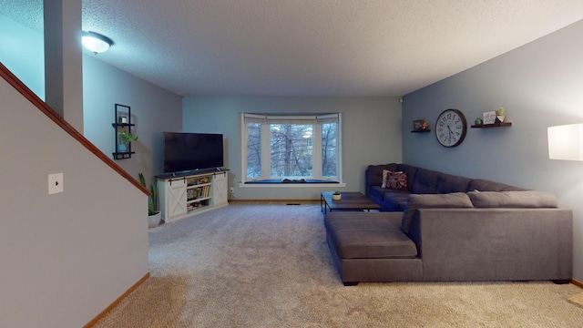 living room with light carpet and a textured ceiling