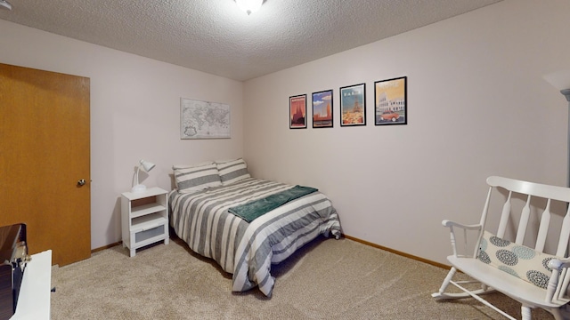 carpeted bedroom with a textured ceiling