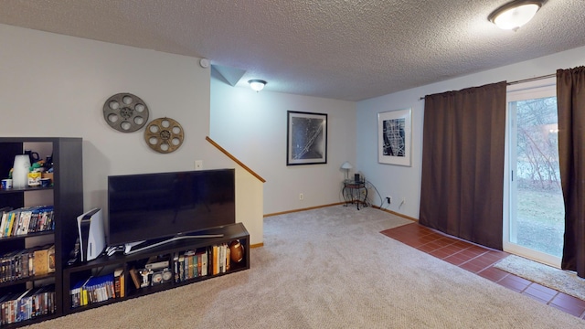 carpeted living room with a healthy amount of sunlight and a textured ceiling