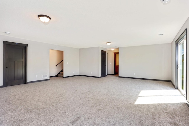 empty room with light colored carpet