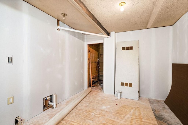 basement with a textured ceiling