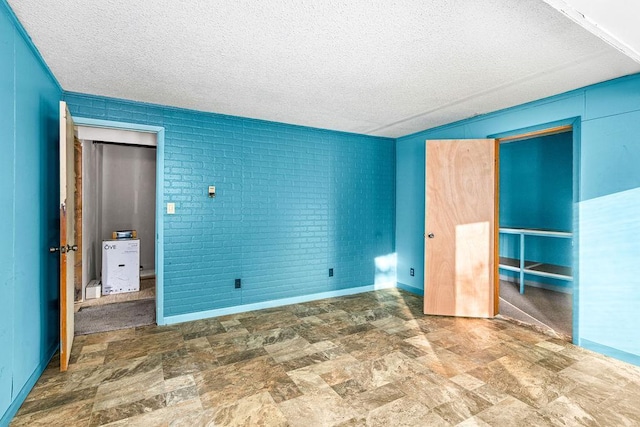 unfurnished bedroom featuring a textured ceiling