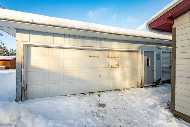 view of snow covered garage