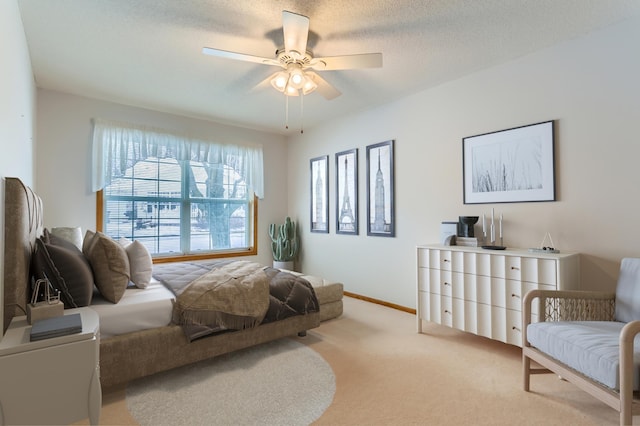 bedroom with light carpet, a textured ceiling, and ceiling fan