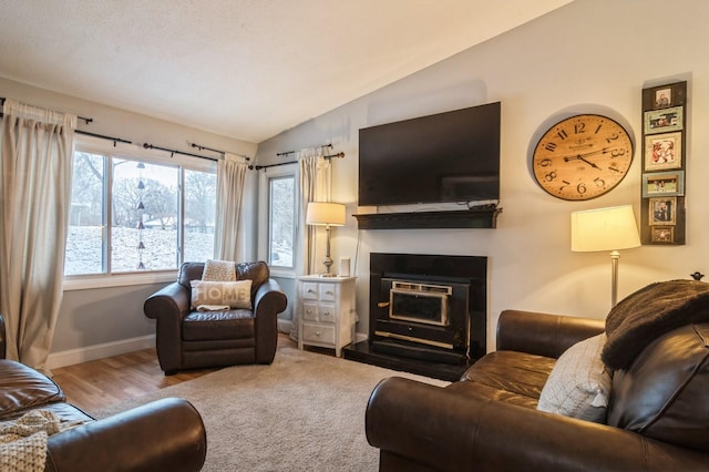 living room featuring hardwood / wood-style floors and vaulted ceiling