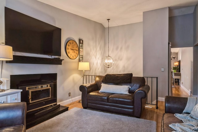 living room featuring hardwood / wood-style floors and an inviting chandelier