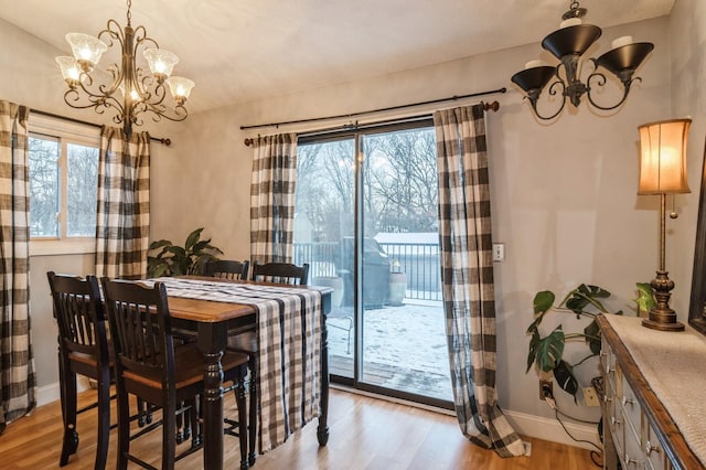 dining area featuring a chandelier and light hardwood / wood-style floors