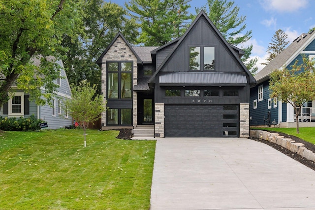 view of front of house featuring a garage and a front yard