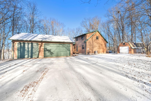 view of front of home featuring an outbuilding and a garage