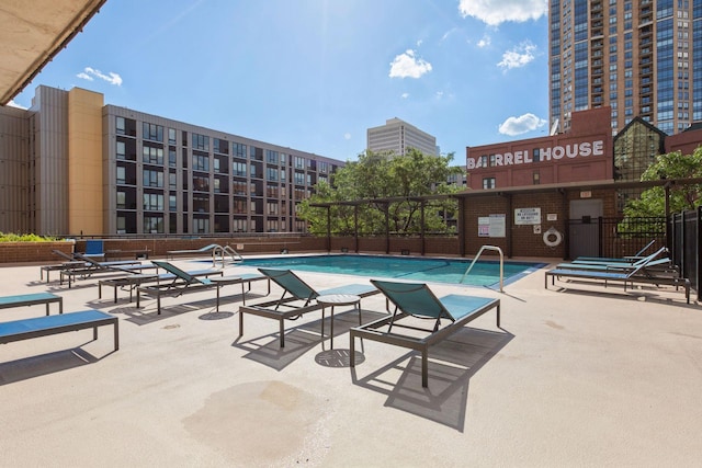 view of swimming pool featuring a patio