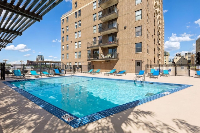 view of pool with a patio area and a pergola