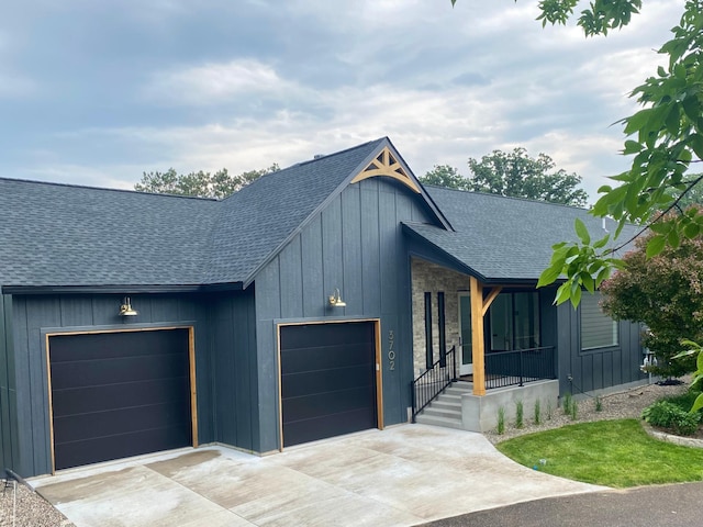 3702 Planting Grn, Stillwater, MN 55082 - view of front of house with roof with shingles, a garage, driveway, and board and batten siding