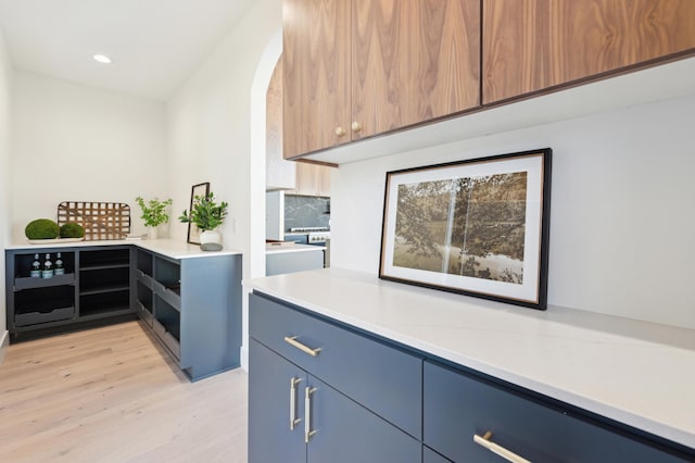 3702 Planting Grn, Stillwater, MN 55082 - kitchen featuring light wood finished floors, blue cabinets, light countertops, modern cabinets, and recessed lighting