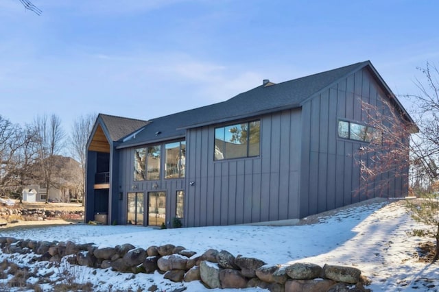 3702 Planting Grn, Stillwater, MN 55082 - view of snowy exterior featuring a shingled roof and board and batten siding